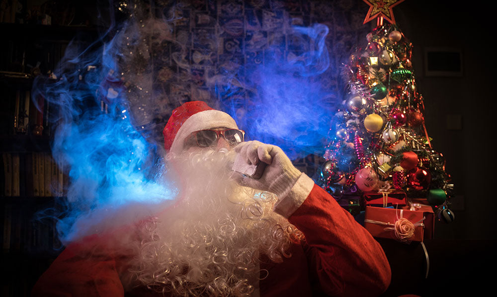 Santa sitting and vaping with xmas tree