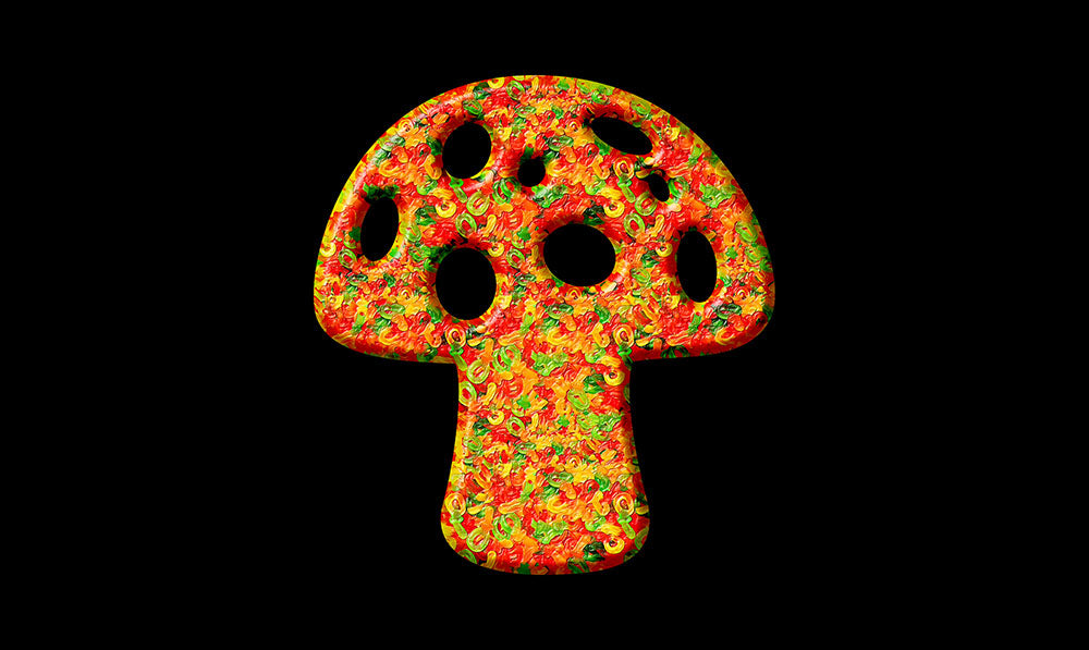 gummies in the shape of a mushroom on black background