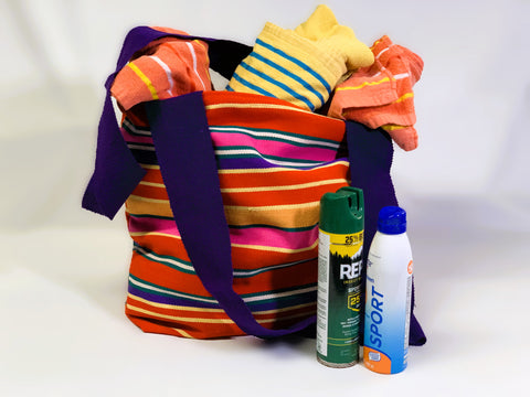 striped tote bag made of Guatemalan fabric with vacation supplies