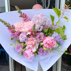 Seasonal flower bouquet with peonies