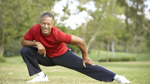 Older adult male stretching 