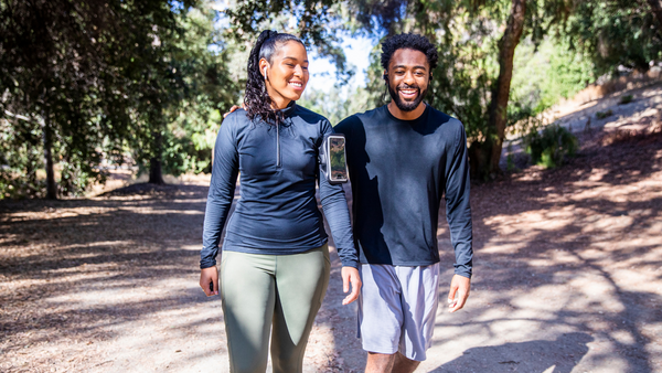 man and woman walking for exercise 