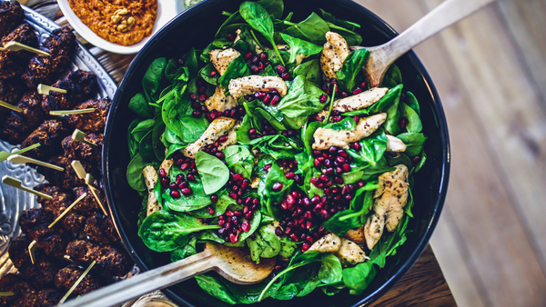 A bowl of vibrant spinach salad