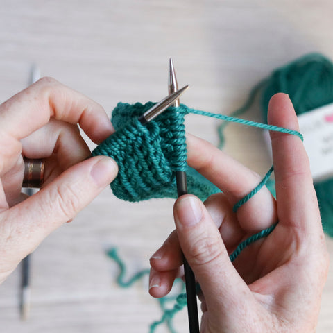 Hot Mess Headband tutorial: Twist and continue knitting to create the cable