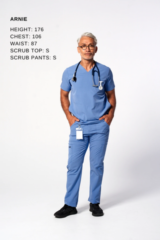 A doctor demonstrates the fit of Dr. Woof Apparel Men's Scrub Tops and Scrub Pants