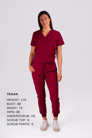 Doctor or nurse demonstrates the fit of Dr. Woof Scrub tops and scrub pants