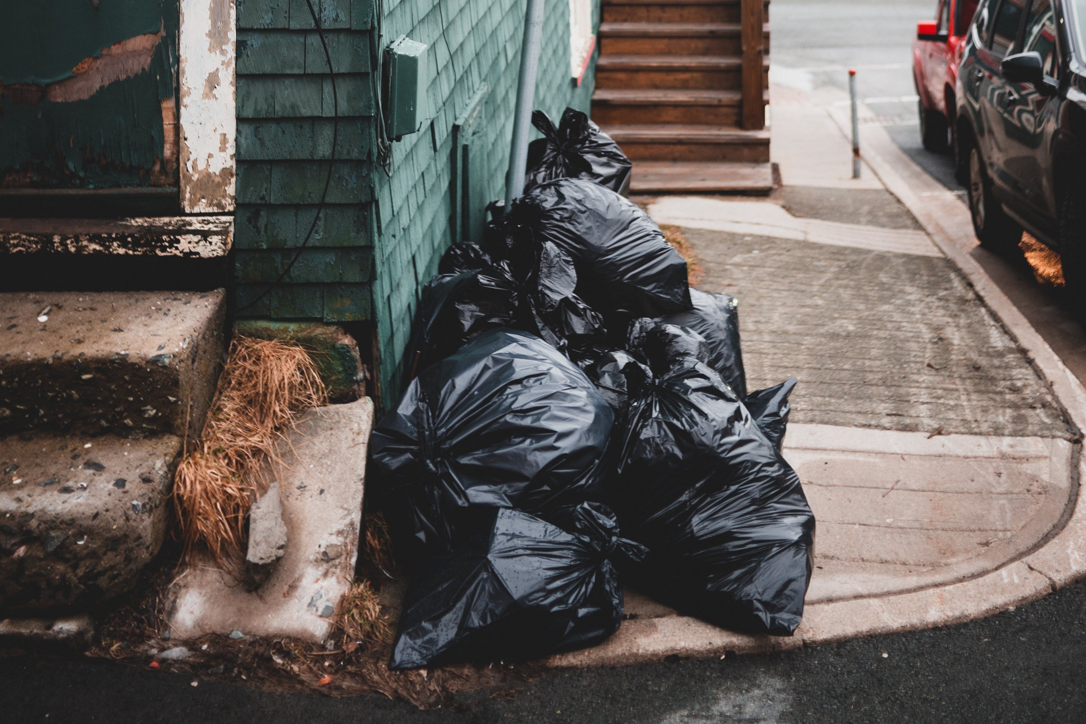 Garbage bags near building on street