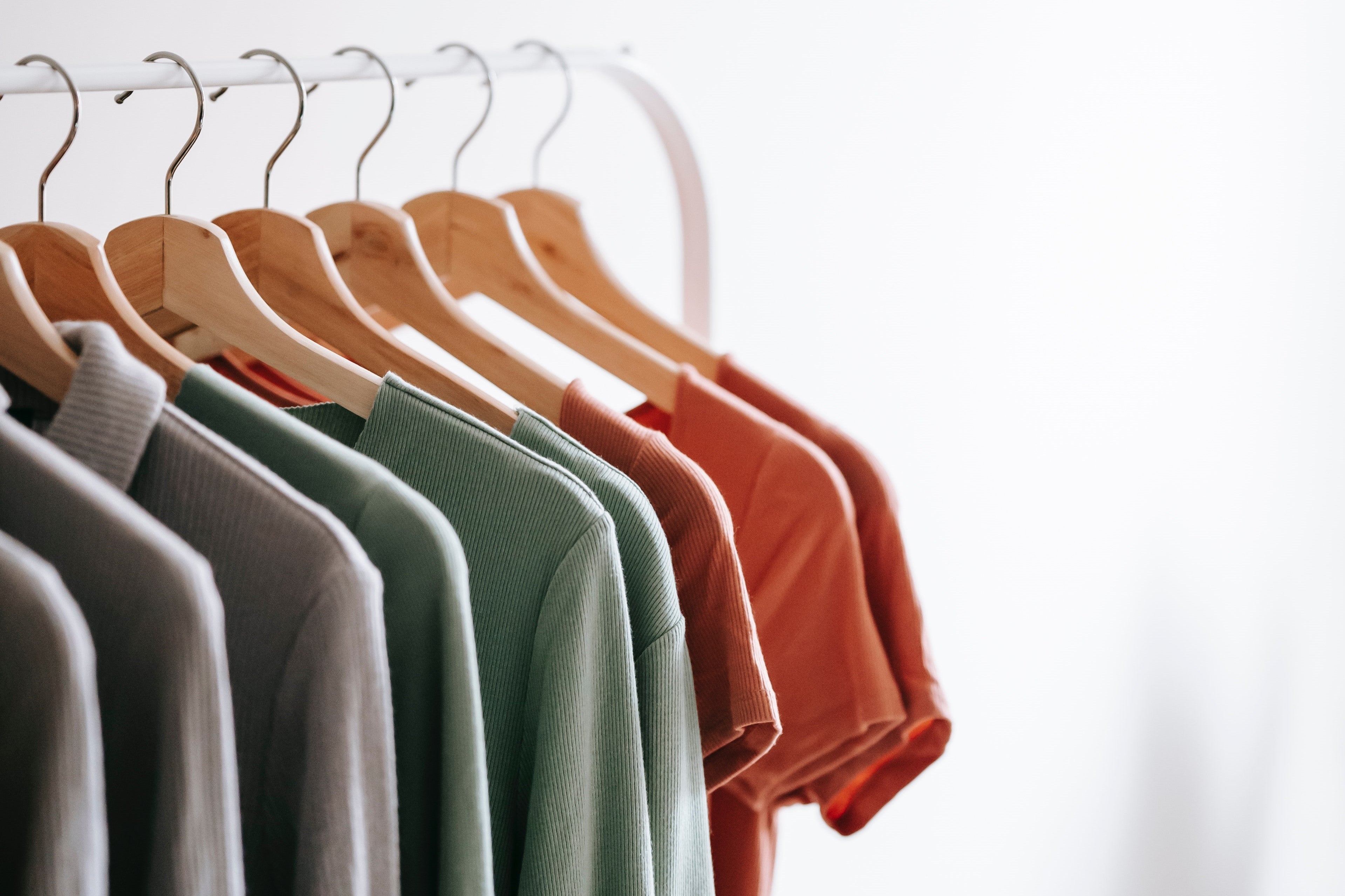 Interior of apartment with apparels on hangers