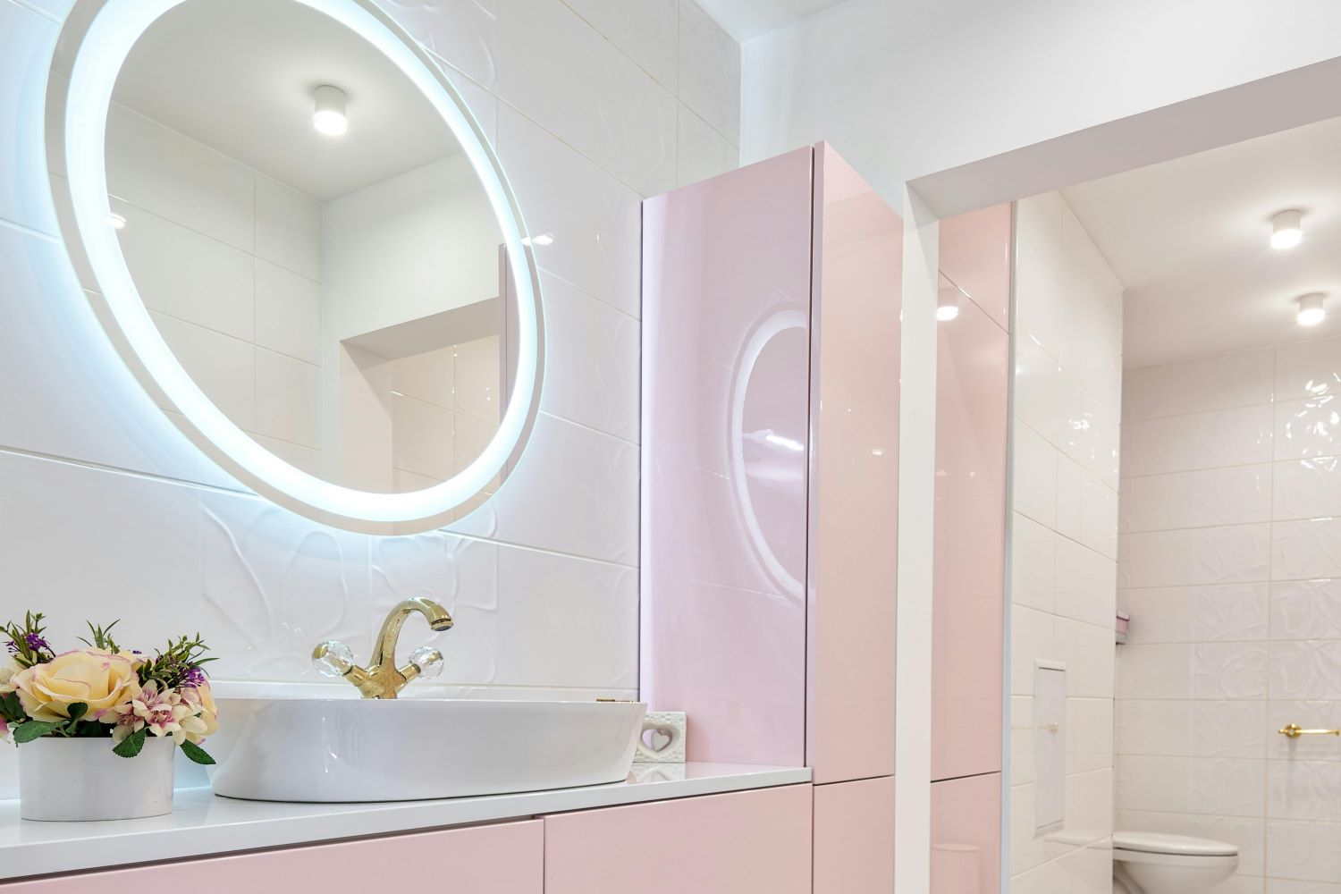 Interior of modern bathroom with glowing mirror