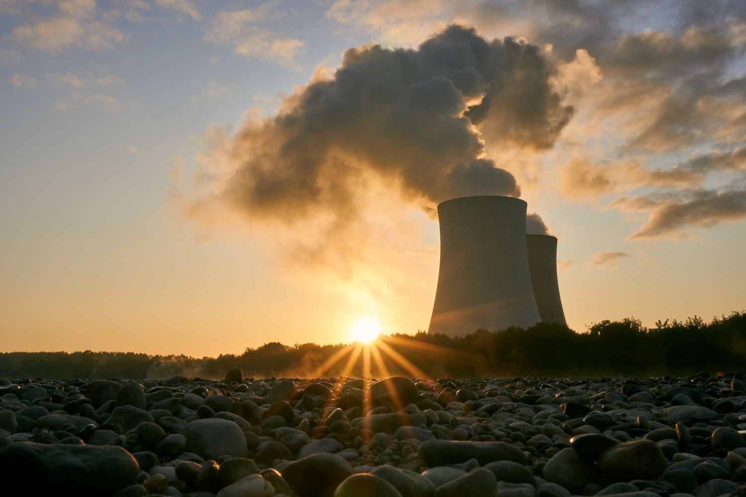 Low Angle Photo Of Nuclear Power Plant Buildings Emitting Smoke