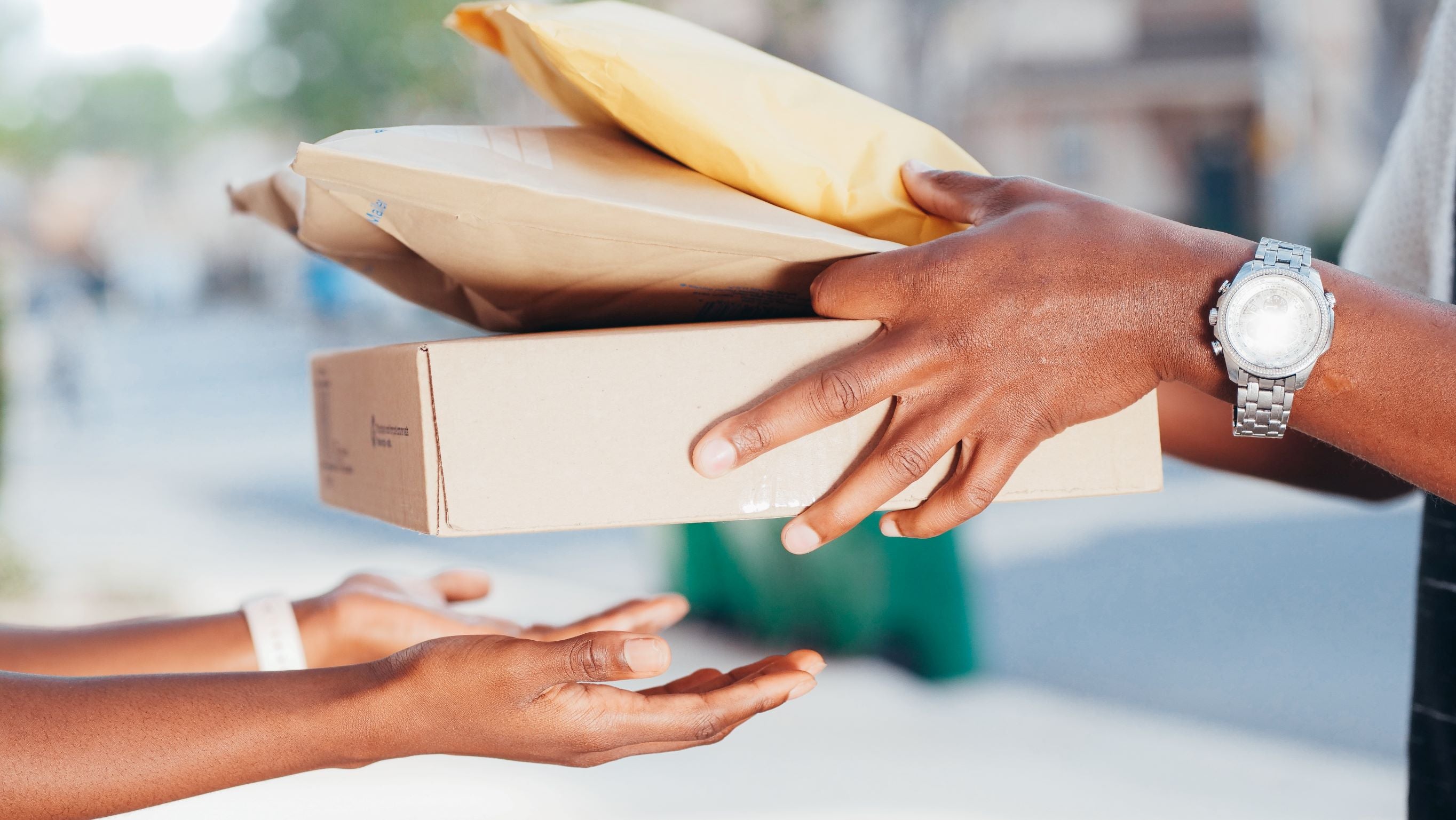 A Person Handing Over Delivery Packages