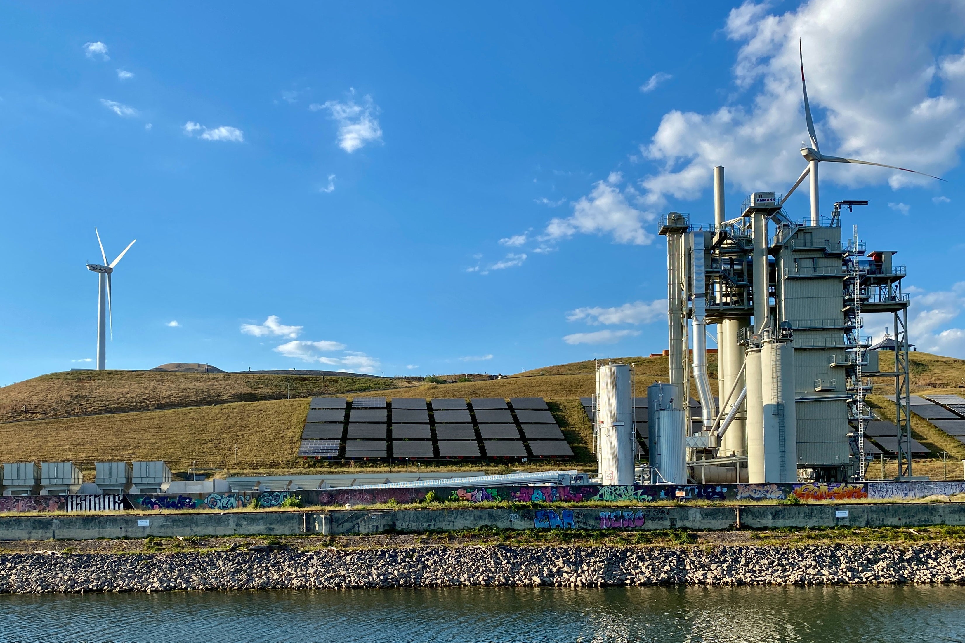 Solar Light Panels on Grass Near Windmills