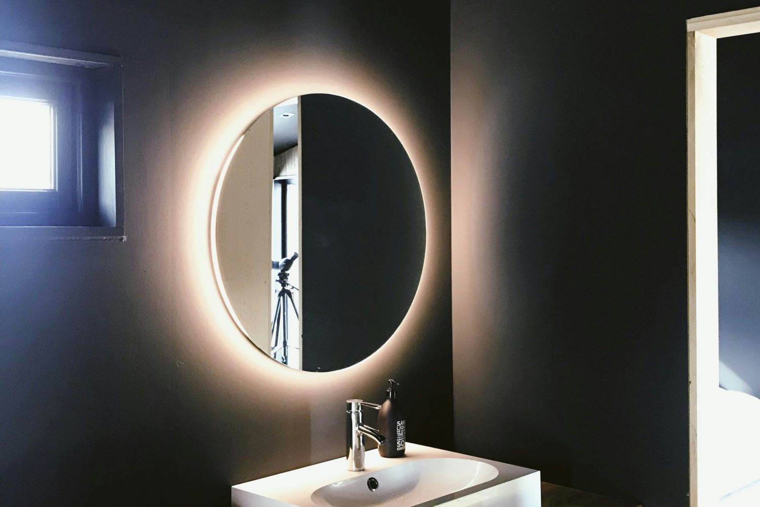 White Sink with Lit Up Mirror