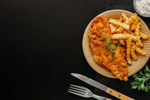 sepiring Chicken Schnitzel lengkap dengan saus dan french fries