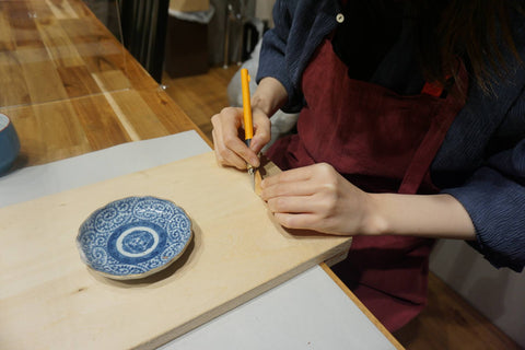 cutting wood for the missing piece during kintsugi