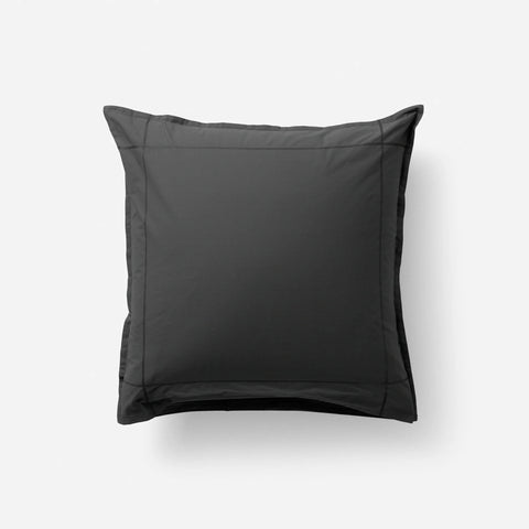 Black square pillow on white background