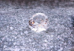 Round cut Diamond on a bed of diamond chips