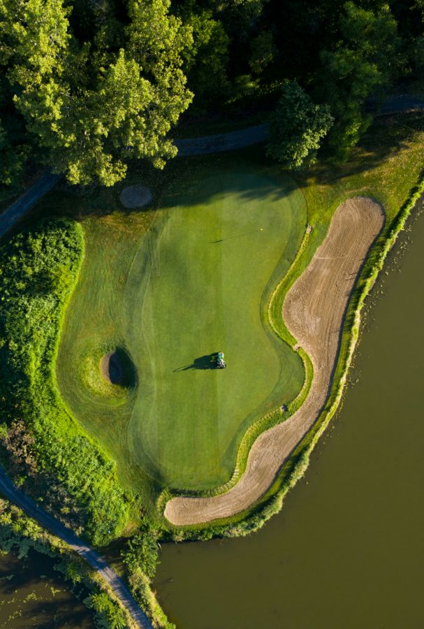 aerial view of green trees beside river during daytime | golf | golf course