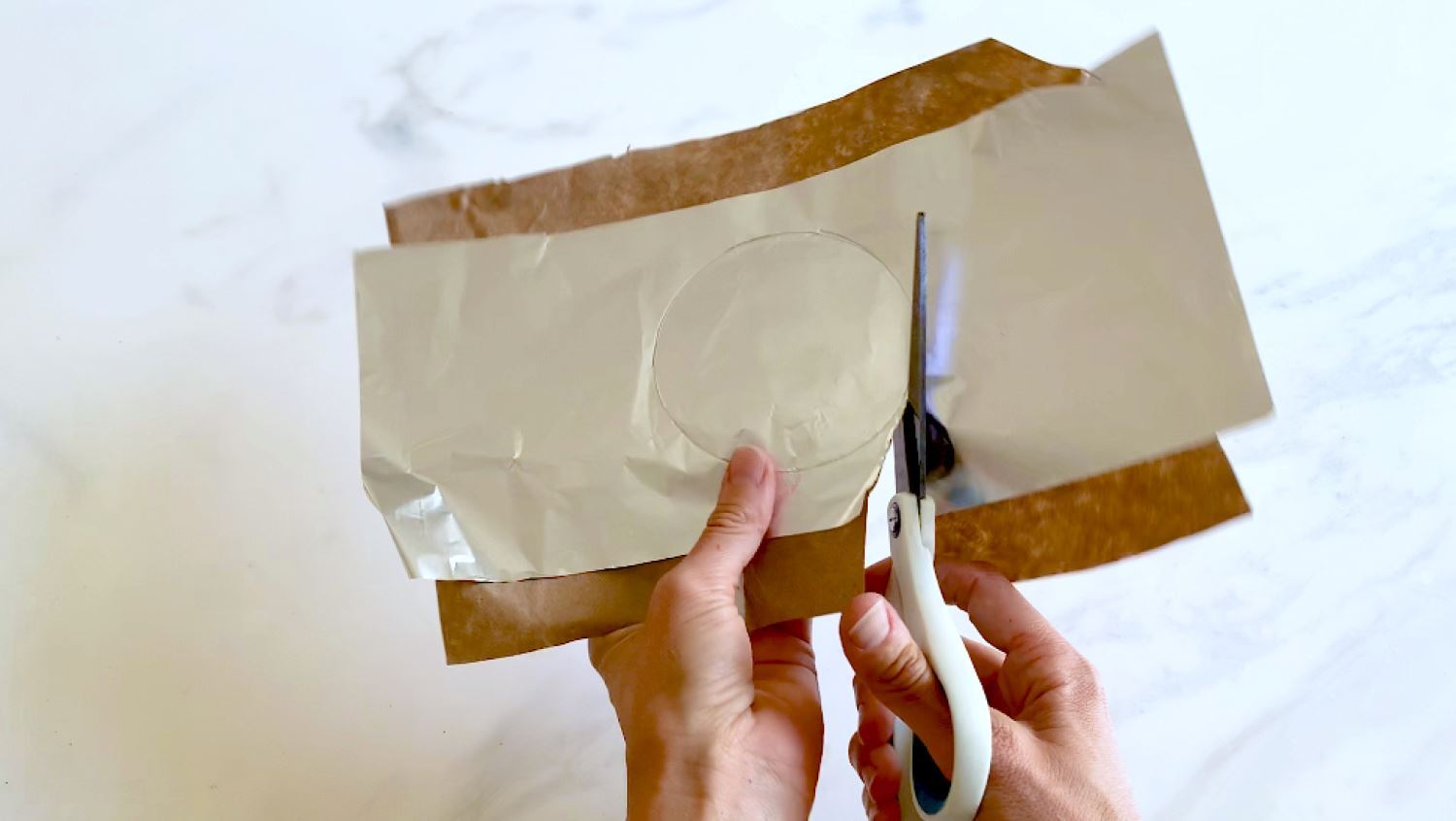 Glue craft paper to foil and cut circles