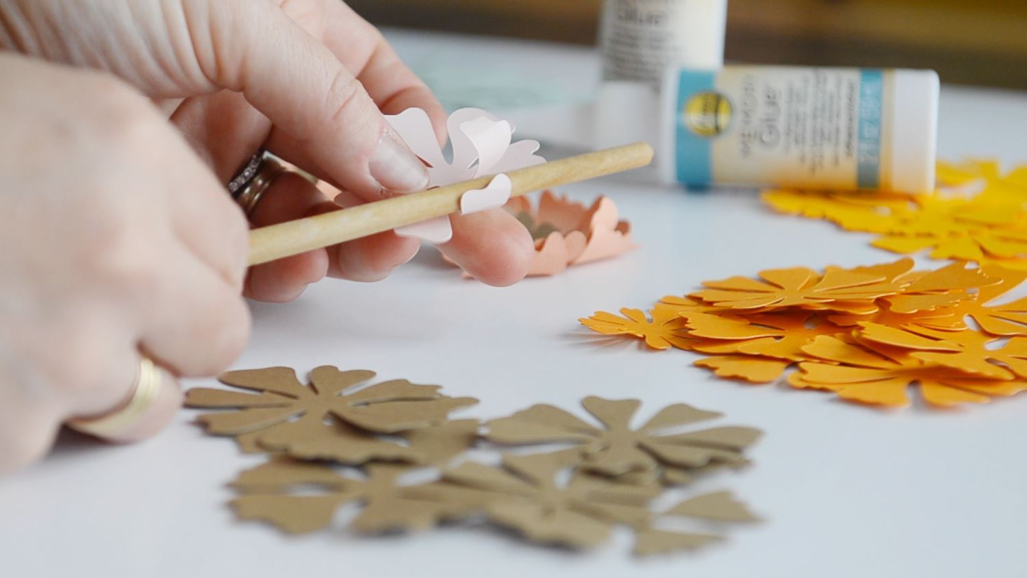Use a pen to curl flower petals for dimension