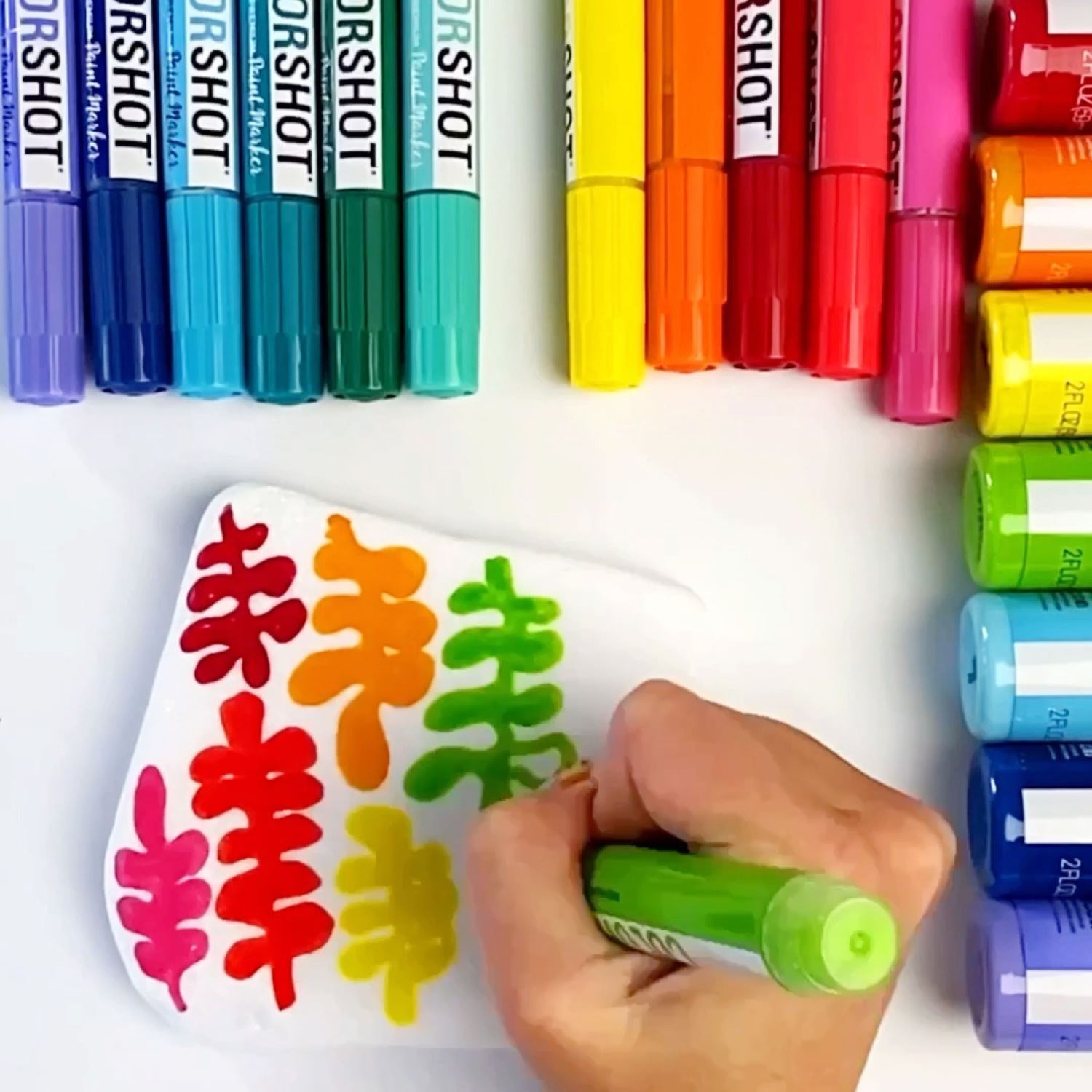 Doodle on rocks with paint markers