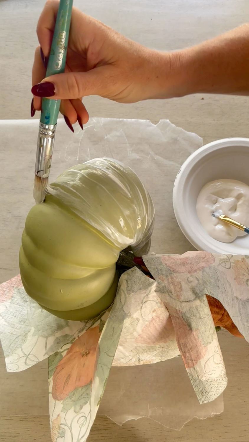 Apply decoupage glue to pumpkin