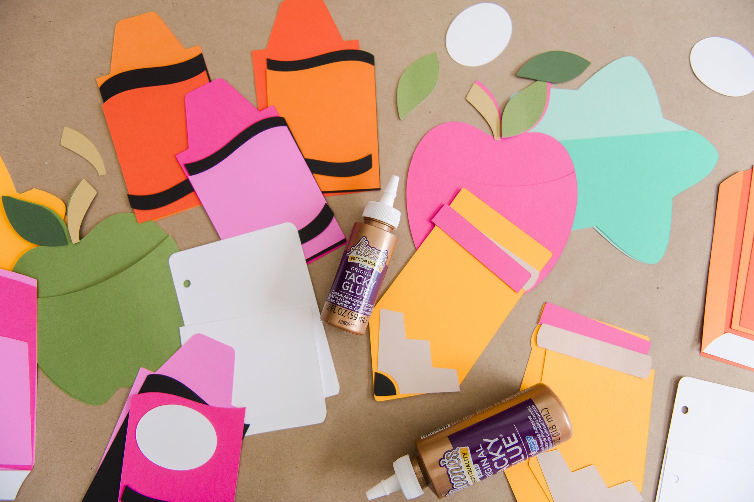 Cut shapes for DIY gift card holders from cardstock