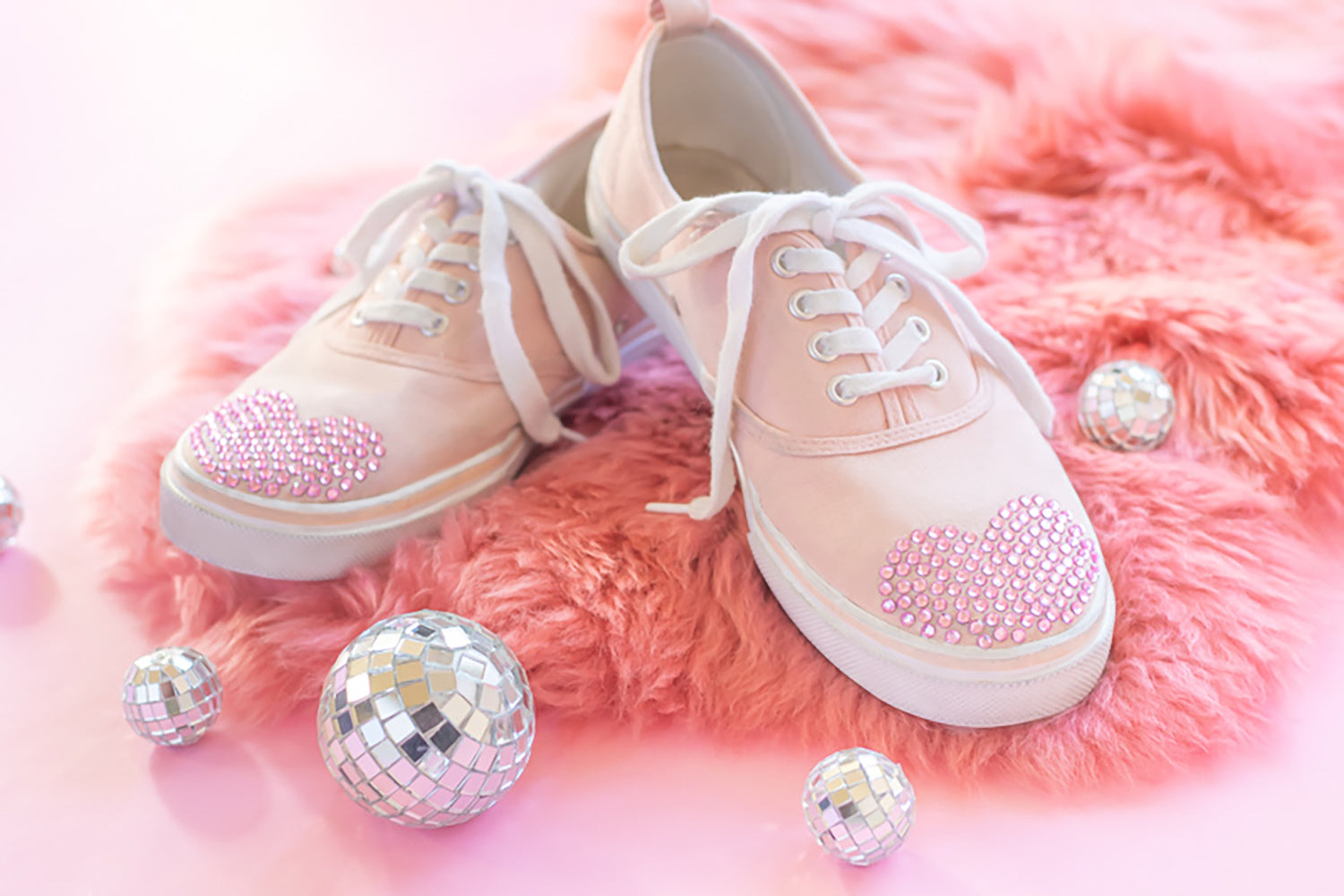 Bedazzled heart shoes with pink rhinestone embellishments