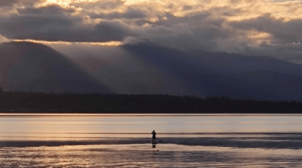 Pounamu staffer Naomi out for a sunset SUP in British Columbia, Canada 