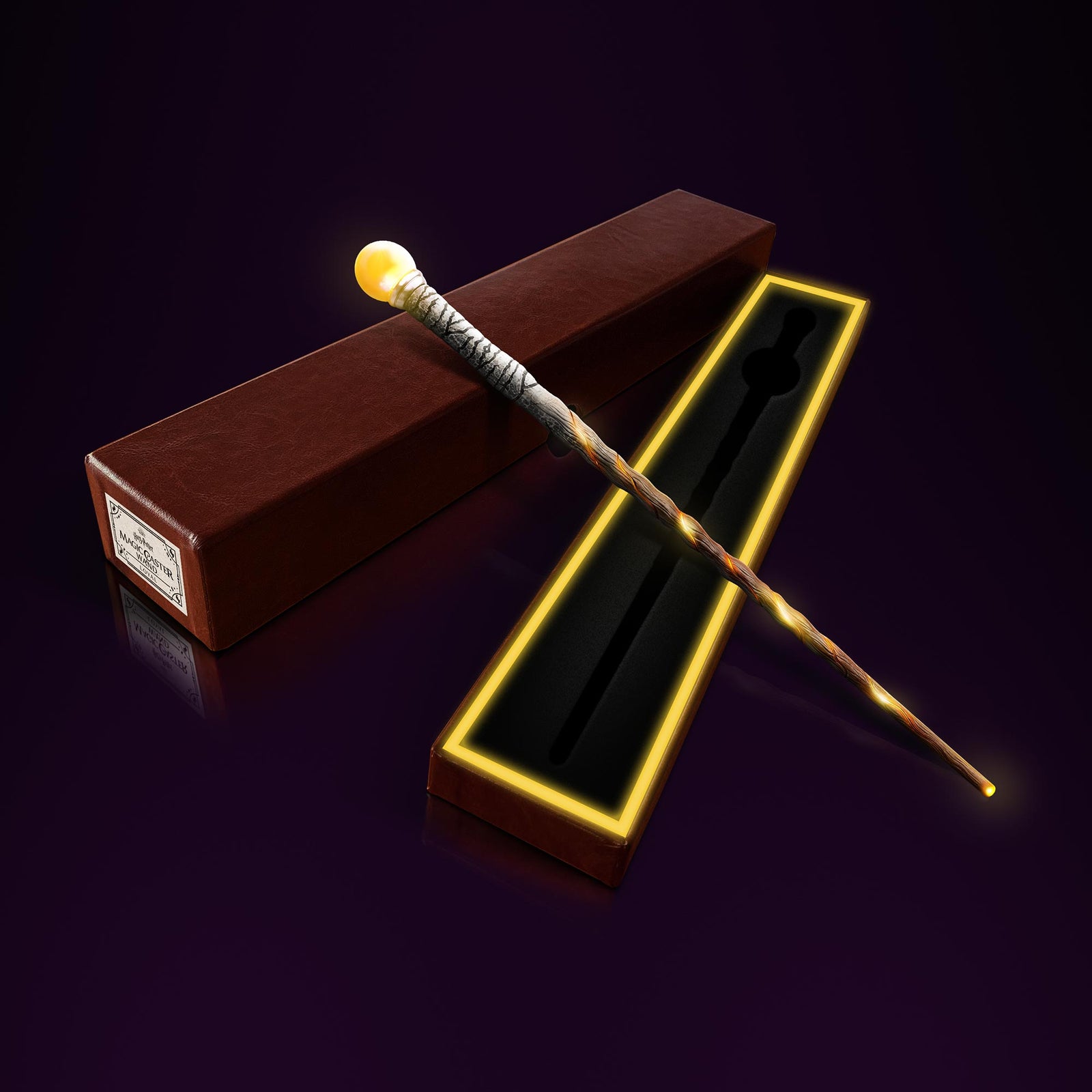 Loyal Loyal wand glowing while laying on top of open wand box