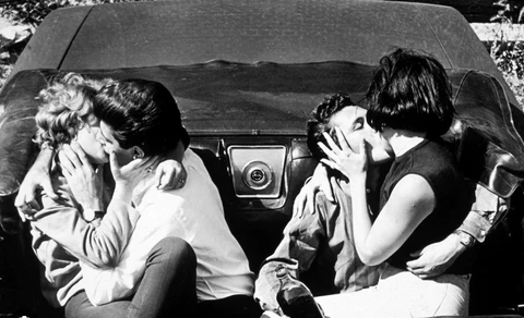 couples kissing in car