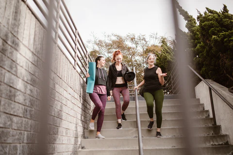 women walking down stairways