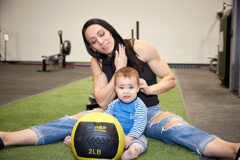 Mother with young child in a gym