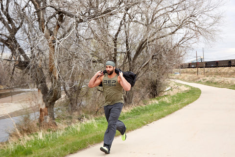 Man running with a sandbag