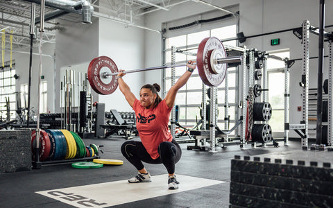 Woman lifting with the 15kg Alpine Bar