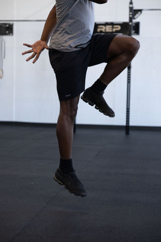 Man working out in REP apparel