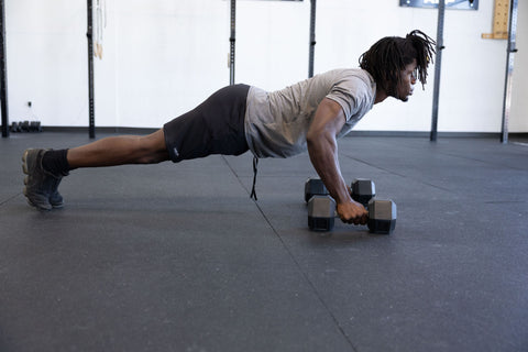 A man doing dumbbell push-ups