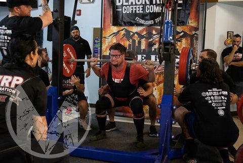 Powerlifter doing heavy squats