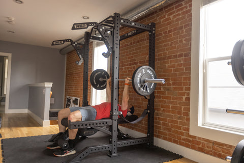 Basement gym with a power rack