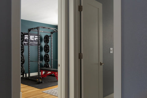 A look into a home gym from the hallway