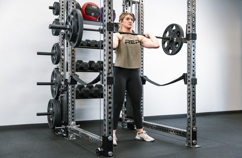 Lifter doing front squats in a power rack