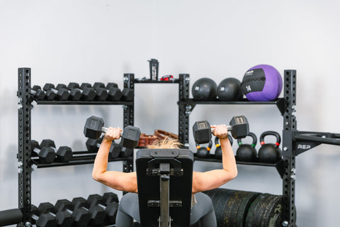 Lifter doing presses near a stand-alone storage unit