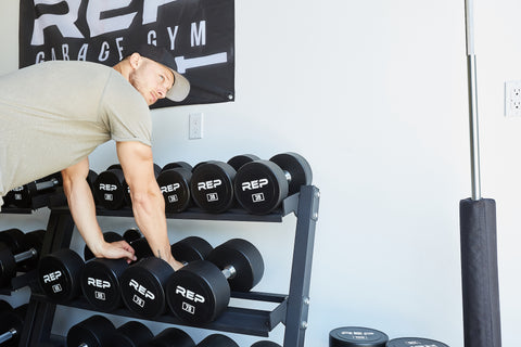 A man picking up barbells