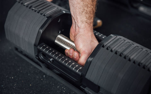 Man using the best adjustable dumbbell