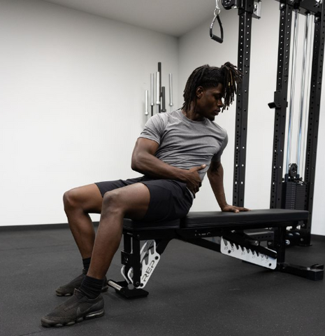 Man in a REP gym shirt