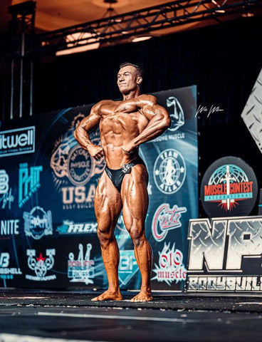 Connor Kovacs competing in a bodybuilding competition