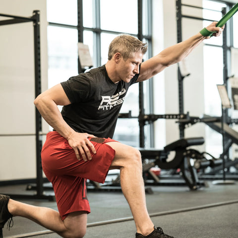 Man using a cable machine in a gym