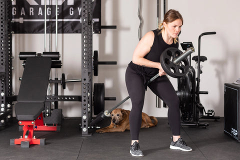 Lifter using the REP Fitness landmine attachment