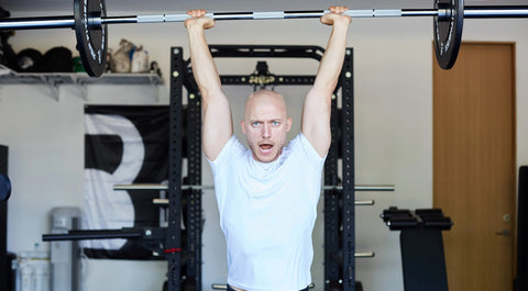 Lifter doing an overhead press