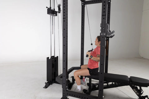 Lifter doing lat pull-downs on a cable machine